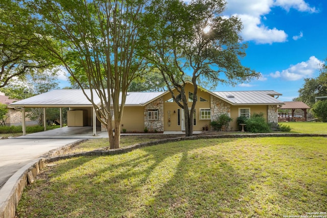 611 Wild Turkey, New Braunfels, TX 78132 - view of front of property with stone siding, a carport, a front lawn, driveway, and a metal roof