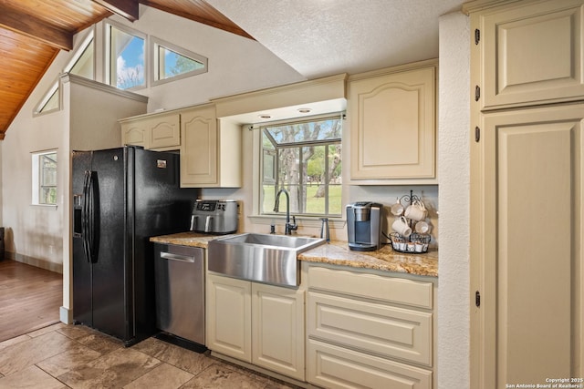 611 Wild Turkey, New Braunfels, TX 78132 - kitchen featuring dishwasher, cream cabinetry, black refrigerator with ice dispenser, and light stone counters