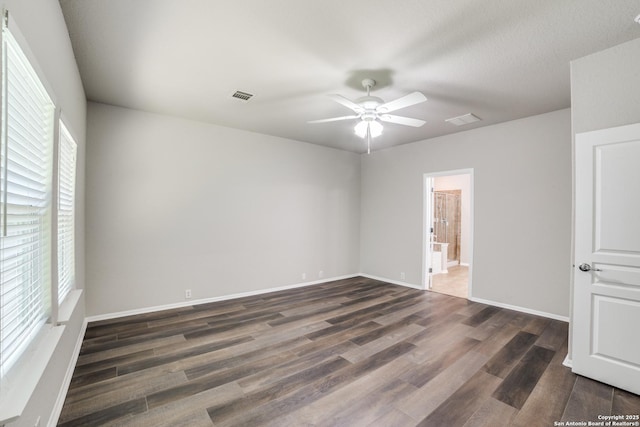 25547 Veining, San Antonio, TX 78261 - empty room with plenty of natural light, a ceiling fan, and wood finished floors