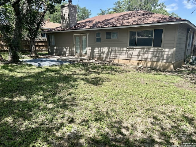 8602 Wood Peak, San Antonio, TX 78251 - back of house featuring french doors, a patio, and a chimney