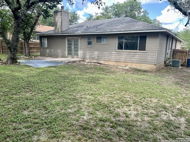 8602 Wood Peak, San Antonio, TX 78251 - rear view of property featuring french doors, a patio area, a chimney, and roof with shingles
