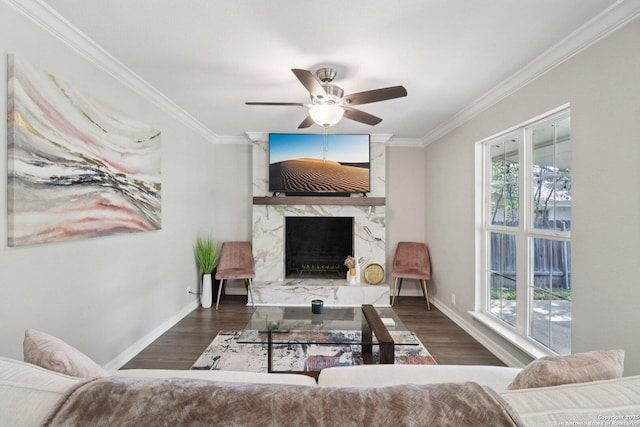 1710 Searcy, San Antonio, TX 78232 - living area featuring a ceiling fan, crown molding, a premium fireplace, plenty of natural light, and wood finished floors