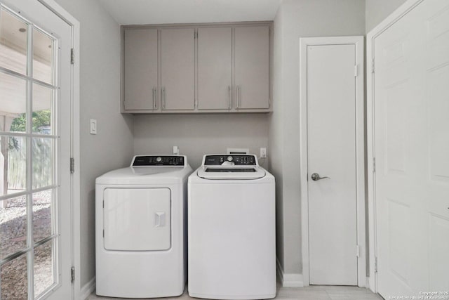 1710 Searcy, San Antonio, TX 78232 - laundry area featuring cabinet space and independent washer and dryer