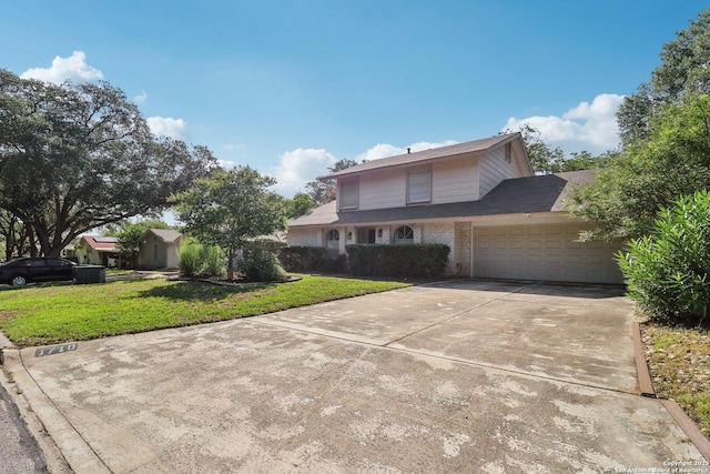 1710 Searcy, San Antonio, TX 78232 - traditional-style home with a garage, a front yard, concrete driveway, and brick siding