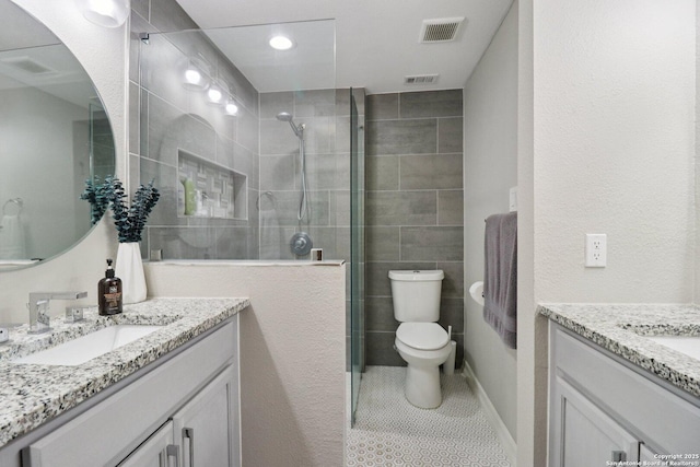 1710 Searcy, San Antonio, TX 78232 - full bath with vanity, tiled shower, and tile patterned floors