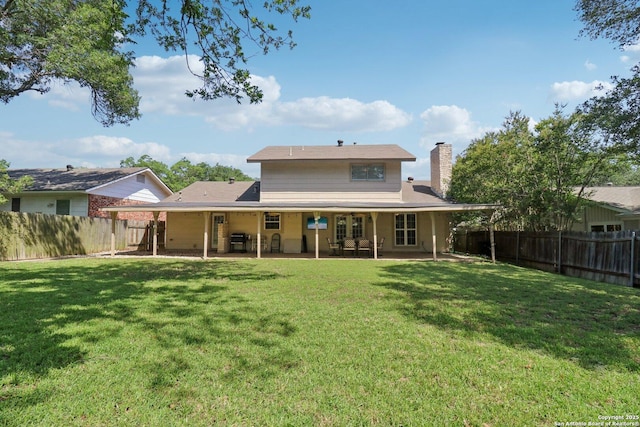 1710 Searcy, San Antonio, TX 78232 - back of property with a chimney, a patio, and a fenced backyard