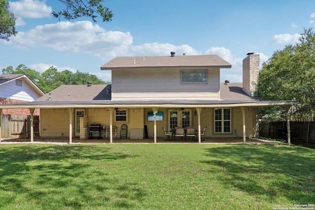 1710 Searcy, San Antonio, TX 78232 - back of property featuring a fenced backyard, a chimney, and a patio