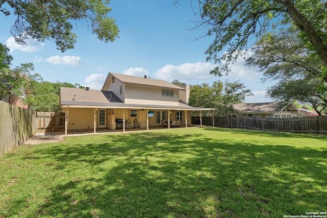 1710 Searcy, San Antonio, TX 78232 - rear view of property featuring a chimney, a fenced backyard, and a patio