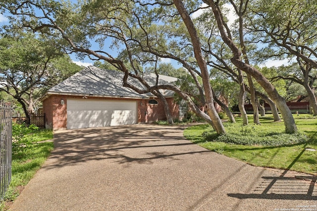 127 Sunflower Ln, San Antonio, TX 78213 - view of front facade with brick siding, asphalt driveway, and a garage