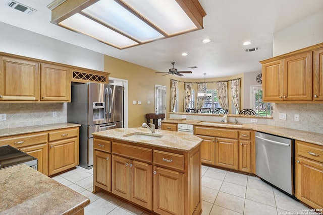 127 Sunflower Ln, San Antonio, TX 78213 - kitchen featuring stainless steel appliances, ceiling fan, a peninsula, backsplash, and recessed lighting