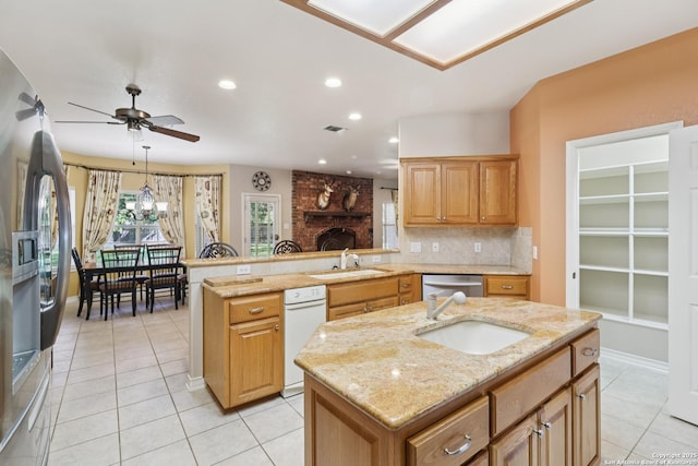 127 Sunflower Ln, San Antonio, TX 78213 - kitchen featuring appliances with stainless steel finishes, light tile patterned flooring, a ceiling fan, a peninsula, and a kitchen island