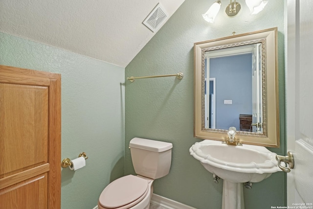127 Sunflower Ln, San Antonio, TX 78213 - bathroom with lofted ceiling and a textured wall