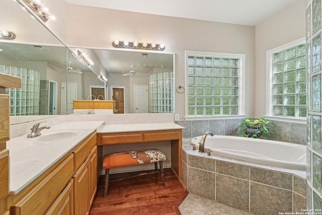 127 Sunflower Ln, San Antonio, TX 78213 - full bath with vanity, a garden tub, ceiling fan, and wood finished floors