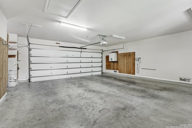 127 Sunflower Ln, San Antonio, TX 78213 - garage with a garage door opener and baseboards