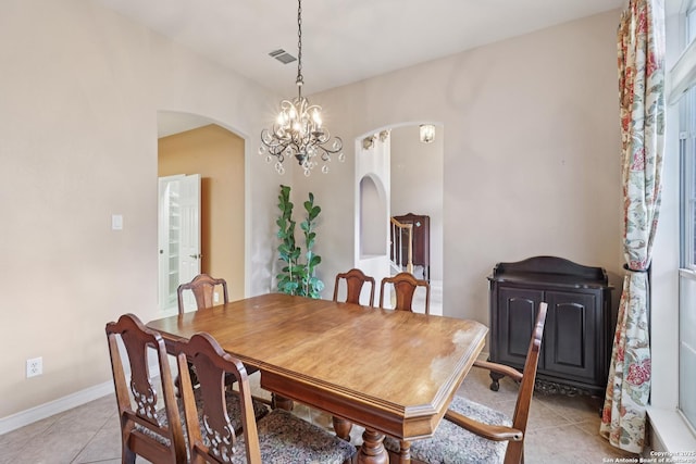 127 Sunflower Ln, San Antonio, TX 78213 - dining area featuring arched walkways, light tile patterned flooring, and a chandelier