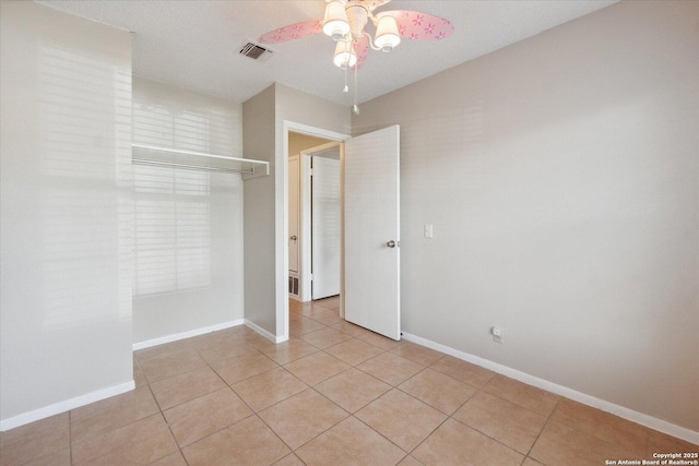 5311 Light House, San Antonio, TX 78242 - unfurnished bedroom featuring light tile patterned floors and a ceiling fan