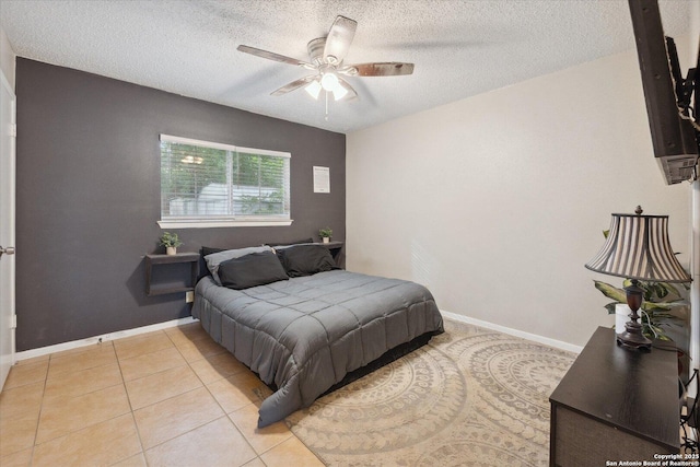 5311 Light House, San Antonio, TX 78242 - bedroom featuring a textured ceiling, ceiling fan, and light tile patterned floors