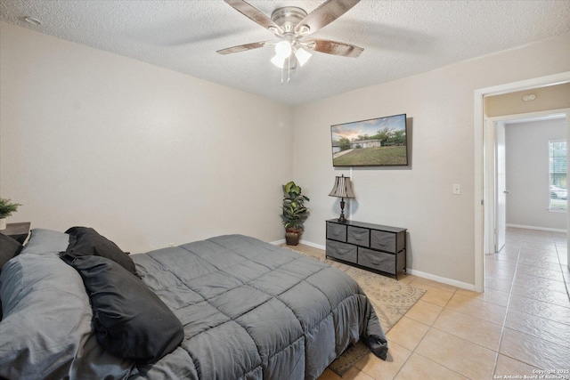 5311 Light House, San Antonio, TX 78242 - bedroom with a textured ceiling, light tile patterned floors, and ceiling fan