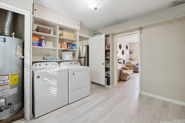 5311 Light House, San Antonio, TX 78242 - laundry area with gas water heater, washing machine and clothes dryer, and light wood-style flooring