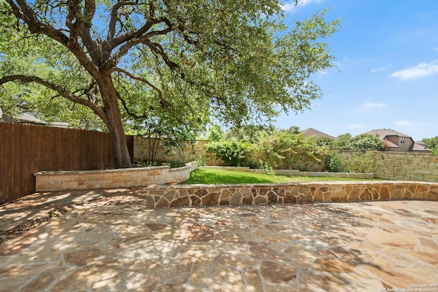 101 Boulder Crk, Boerne, TX 78006 - fenced backyard with a patio area