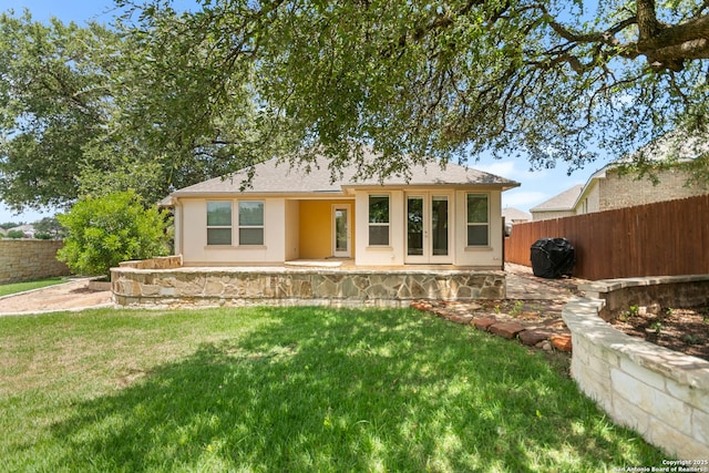 101 Boulder Crk, Boerne, TX 78006 - view of front of property featuring a fenced backyard, stucco siding, a patio, and a shingled roof