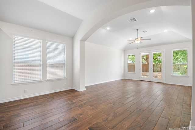 101 Boulder Crk, Boerne, TX 78006 - unfurnished living room featuring a ceiling fan, dark wood-style flooring, arched walkways, lofted ceiling, and recessed lighting