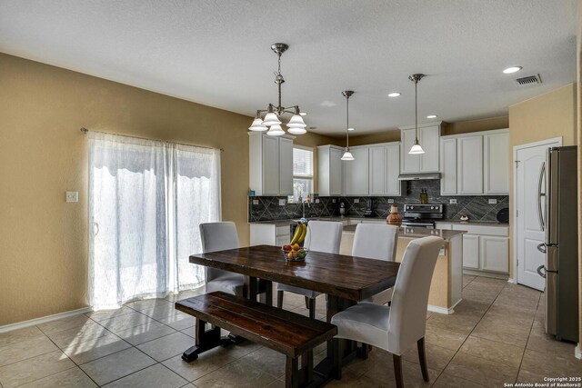 168 Landmark Park, Cibolo, TX 78108 - dining room with light tile patterned floors and recessed lighting