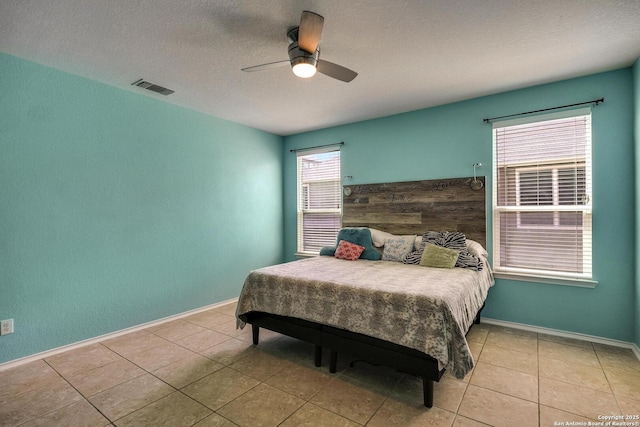 168 Landmark Park, Cibolo, TX 78108 - bedroom featuring light tile patterned floors, a ceiling fan, and a textured ceiling