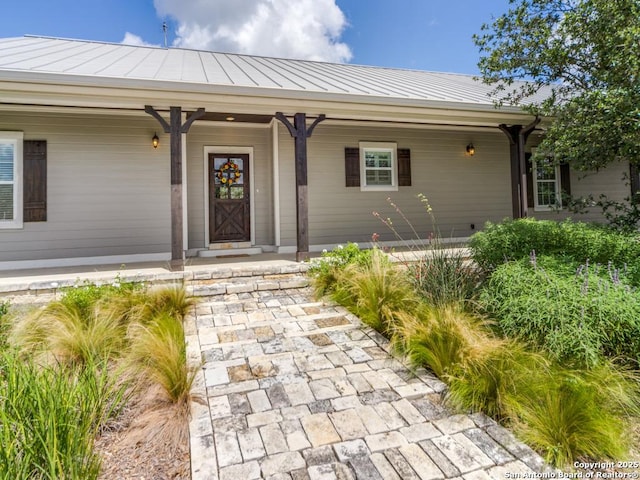 2521 Bay Hl, Bulverde, TX 78163 - view of exterior entry featuring a porch and a metal roof