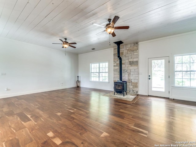 2521 Bay Hl, Bulverde, TX 78163 - unfurnished living room featuring crown molding, a wood stove, ceiling fan, wooden ceiling, and wood finished floors