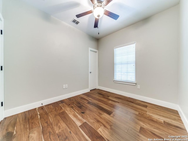2521 Bay Hl, Bulverde, TX 78163 - spare room featuring a ceiling fan and wood finished floors