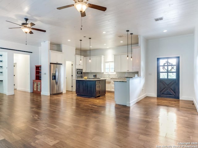 2521 Bay Hl, Bulverde, TX 78163 - kitchen featuring stainless steel fridge, a ceiling fan, white cabinetry, recessed lighting, and ornamental molding