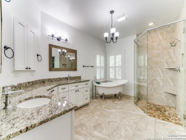 2521 Bay Hl, Bulverde, TX 78163 - full bathroom with a chandelier, double vanity, a shower stall, and a soaking tub