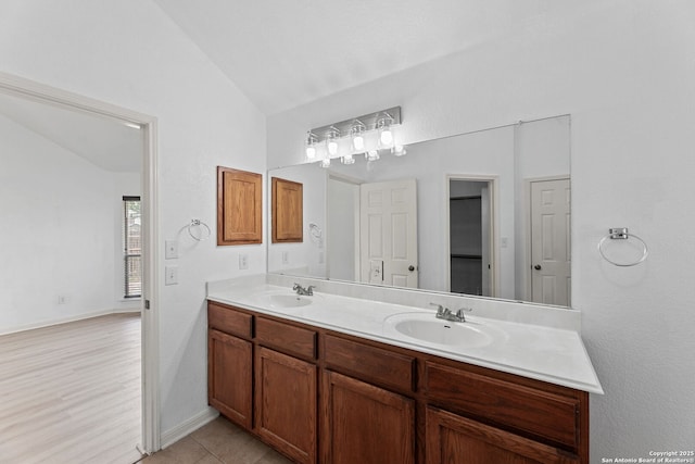 153 Bison Ln, Cibolo, TX 78108 - bathroom featuring lofted ceiling and double vanity