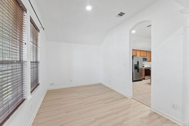 153 Bison Ln, Cibolo, TX 78108 - additional living space with arched walkways, light wood finished floors, lofted ceiling, and recessed lighting