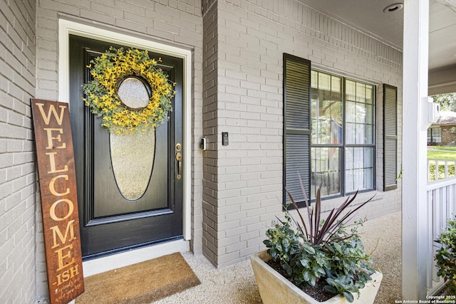21005 Hickory Bnd, Garden Ridge, TX 78266 - doorway to property featuring a porch and brick siding