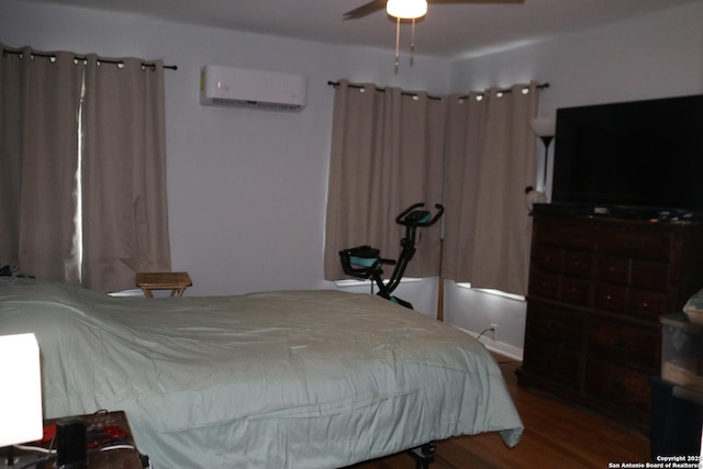 1703 Texas, San Antonio, TX 78201 - bedroom with a wall mounted AC, wood finished floors, and ceiling fan
