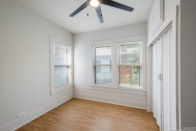1002 Aganier, San Antonio, TX 78212 - unfurnished bedroom featuring light wood-style floors and a ceiling fan