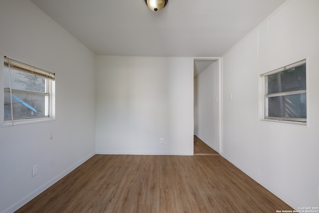 1002 Aganier, San Antonio, TX 78212 - unfurnished room with wood finished floors and baseboards
