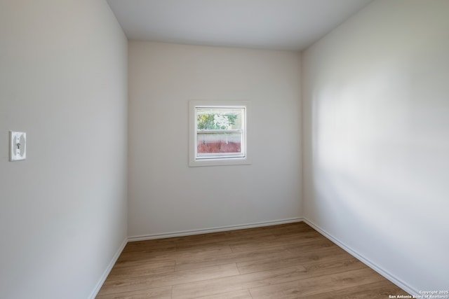 1002 Aganier, San Antonio, TX 78212 - unfurnished room with light wood-style floors and baseboards
