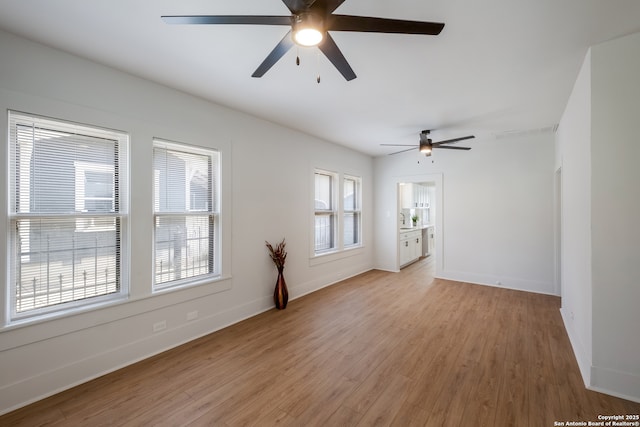 1002 Aganier, San Antonio, TX 78212 - unfurnished room with a ceiling fan and light wood-type flooring