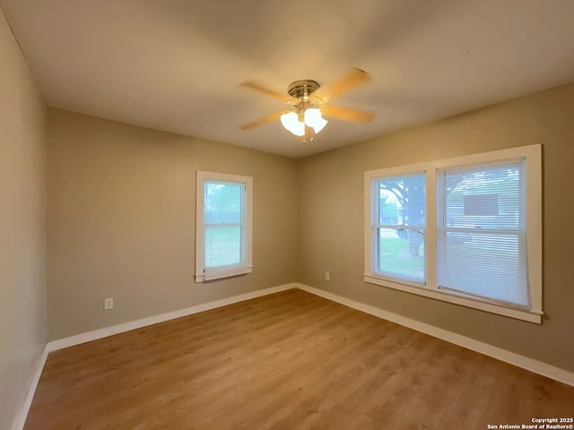 443 Seele, New Braunfels, TX 78130 - unfurnished room with wood finished floors and ceiling fan