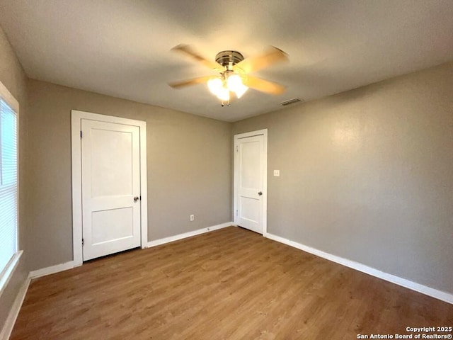 443 Seele, New Braunfels, TX 78130 - spare room featuring a ceiling fan and wood finished floors