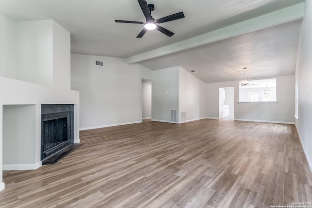 3311 Coral Grove, San Antonio, TX 78247 - unfurnished living room featuring a chandelier, ceiling fan, wood finished floors, and a fireplace