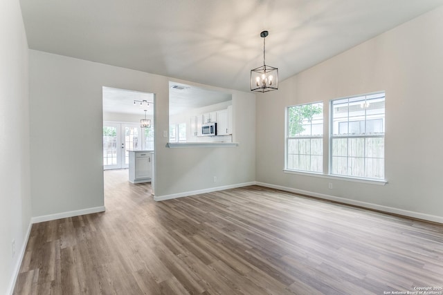 3311 Coral Grove, San Antonio, TX 78247 - spare room with a chandelier and wood finished floors
