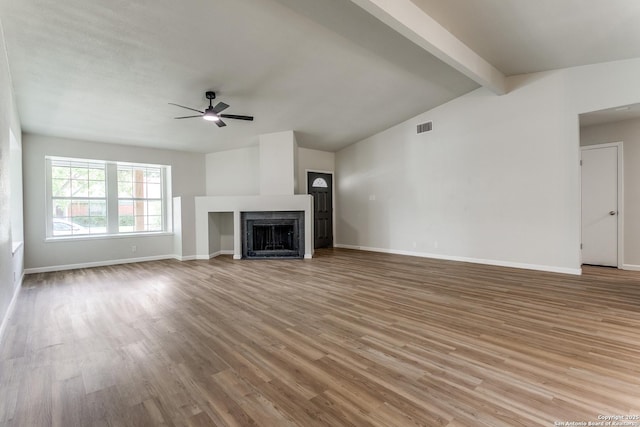 3311 Coral Grove, San Antonio, TX 78247 - unfurnished living room featuring ceiling fan, wood finished floors, and a fireplace