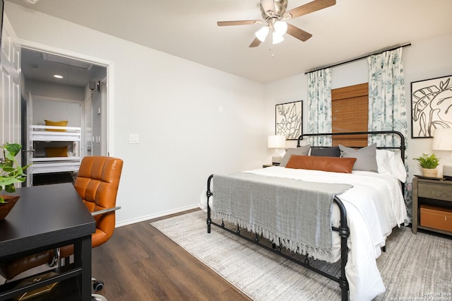 559 W Nacogdoches St, New Braunfels, TX 78130 - bedroom featuring attic access, wood finished floors, and a ceiling fan