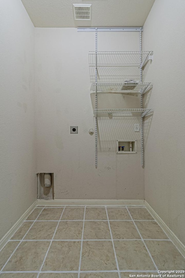 1203 Ganton, San Antonio, TX 78260 - washroom with electric dryer hookup, hookup for a washing machine, and tile patterned flooring