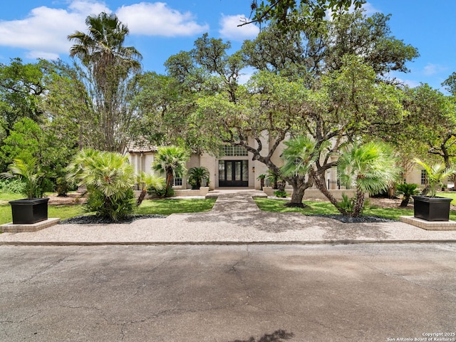 6 De Zavala, Shavano Park, TX 78231 - view of property hidden behind natural elements featuring french doors and stucco siding