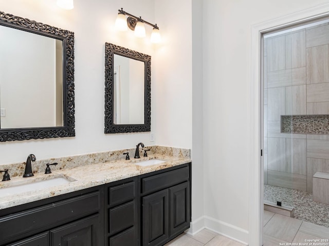 6 De Zavala, Shavano Park, TX 78231 - bathroom with tiled shower, double vanity, and tile patterned flooring